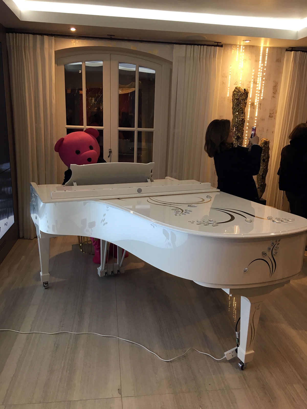 Pink Bear playing the Lalique Steinway at Holiday House