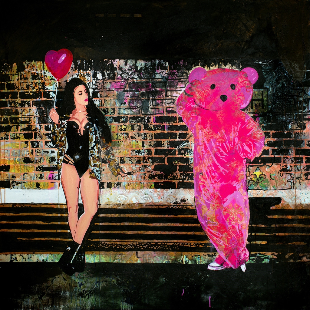 Victoria Tansey poses with the Pink Bear dressed in rubber