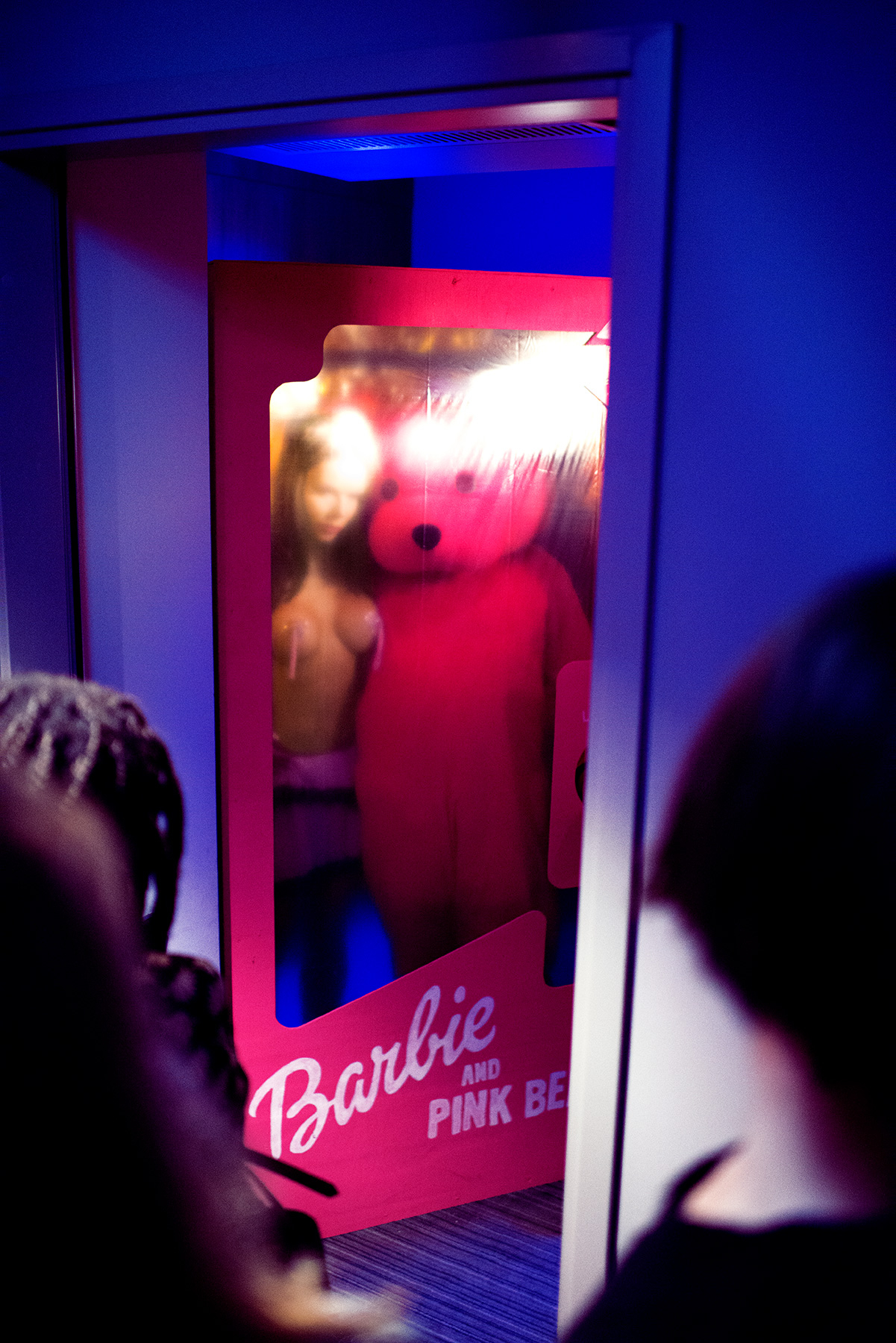Barbie and The Pink Bear start the performance in human sized product packaging. Barbie and The Pink Bear start the performance in human sized product packaging.